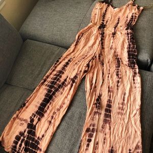 Salmon colored tie dye wide leg V-neck jumpsuit